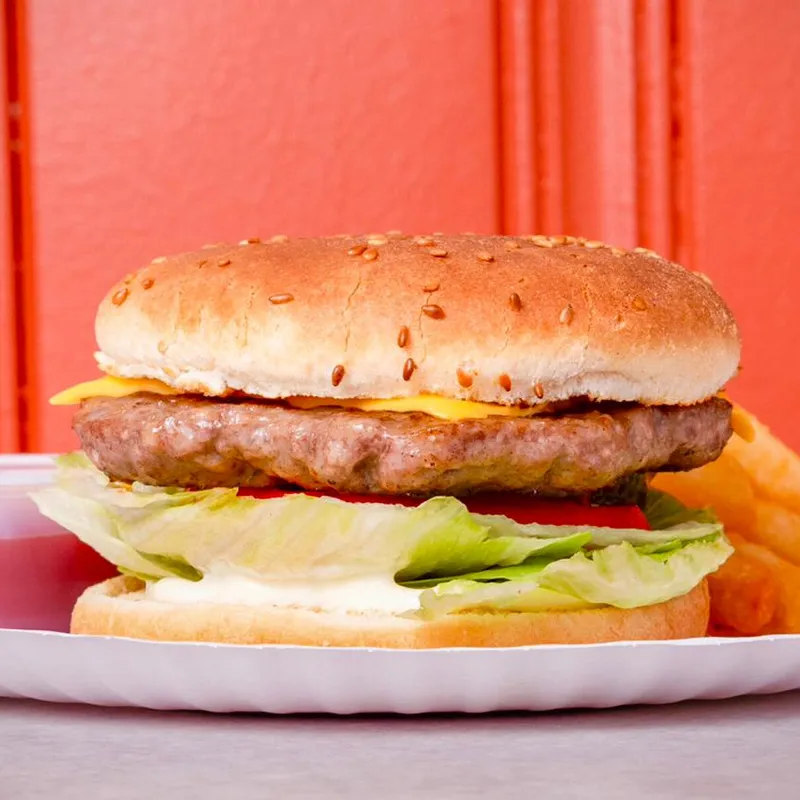 Cheeseburger with melted cheese, lettuce and tomato