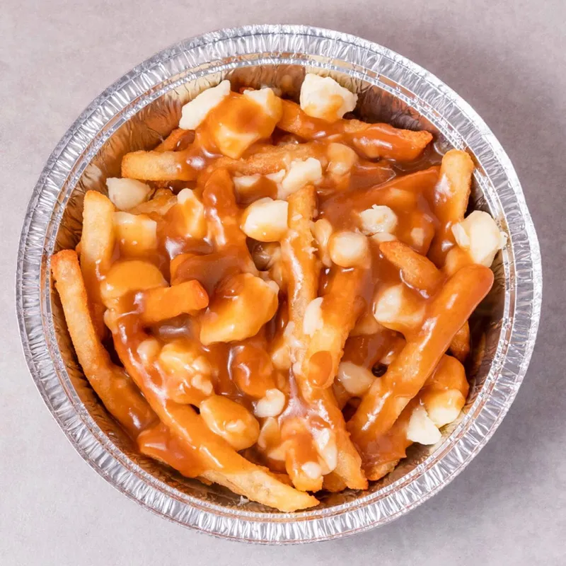 Poutine with fresh cheese curds and hot gravy